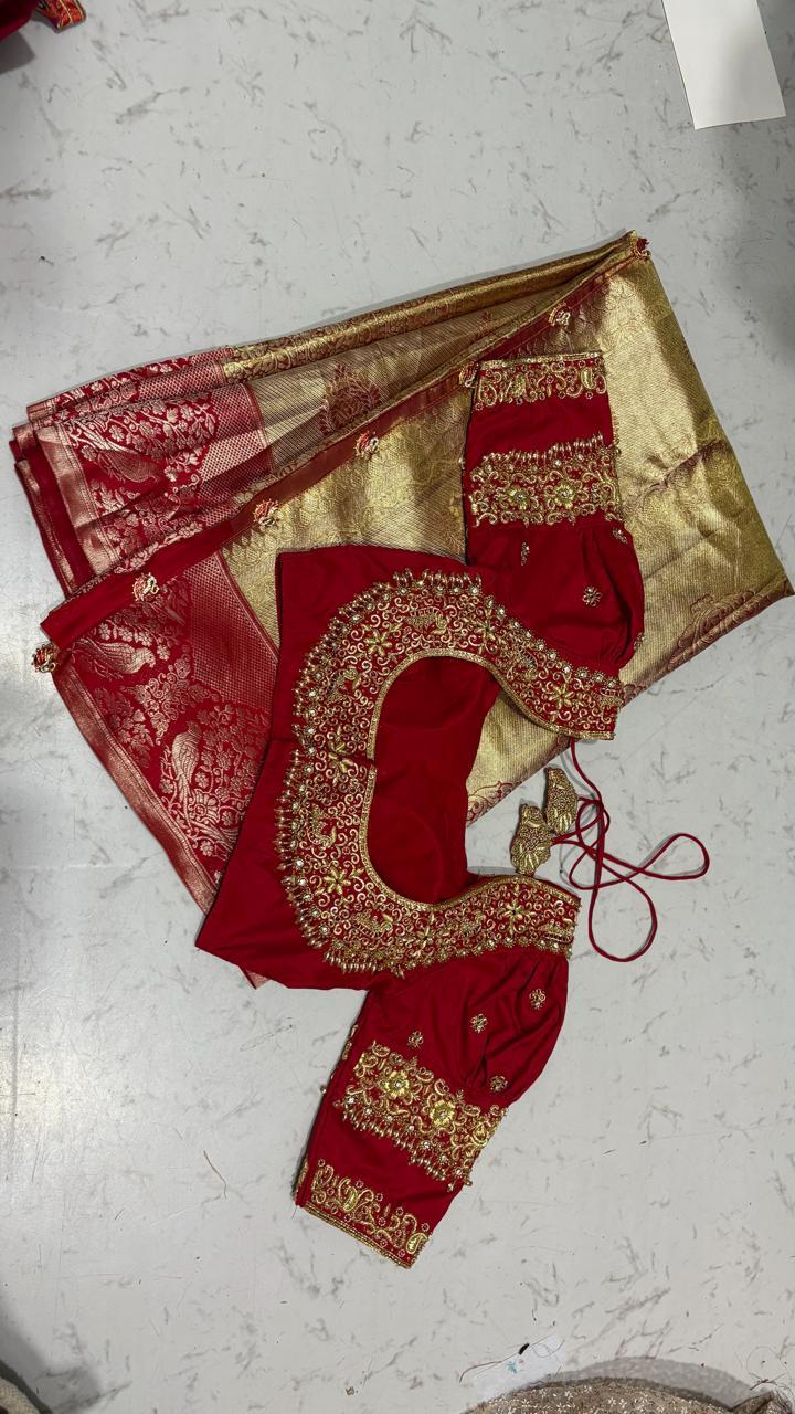 Red bridal blouse with gold zari embroidery and traditional neckline design