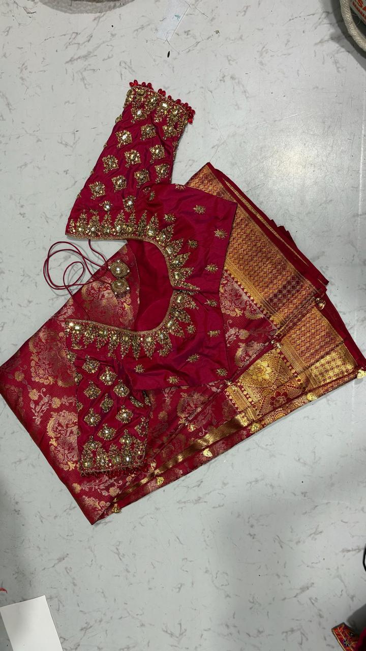 Maroon bridal blouse with gold zari embroidery and floral patterns