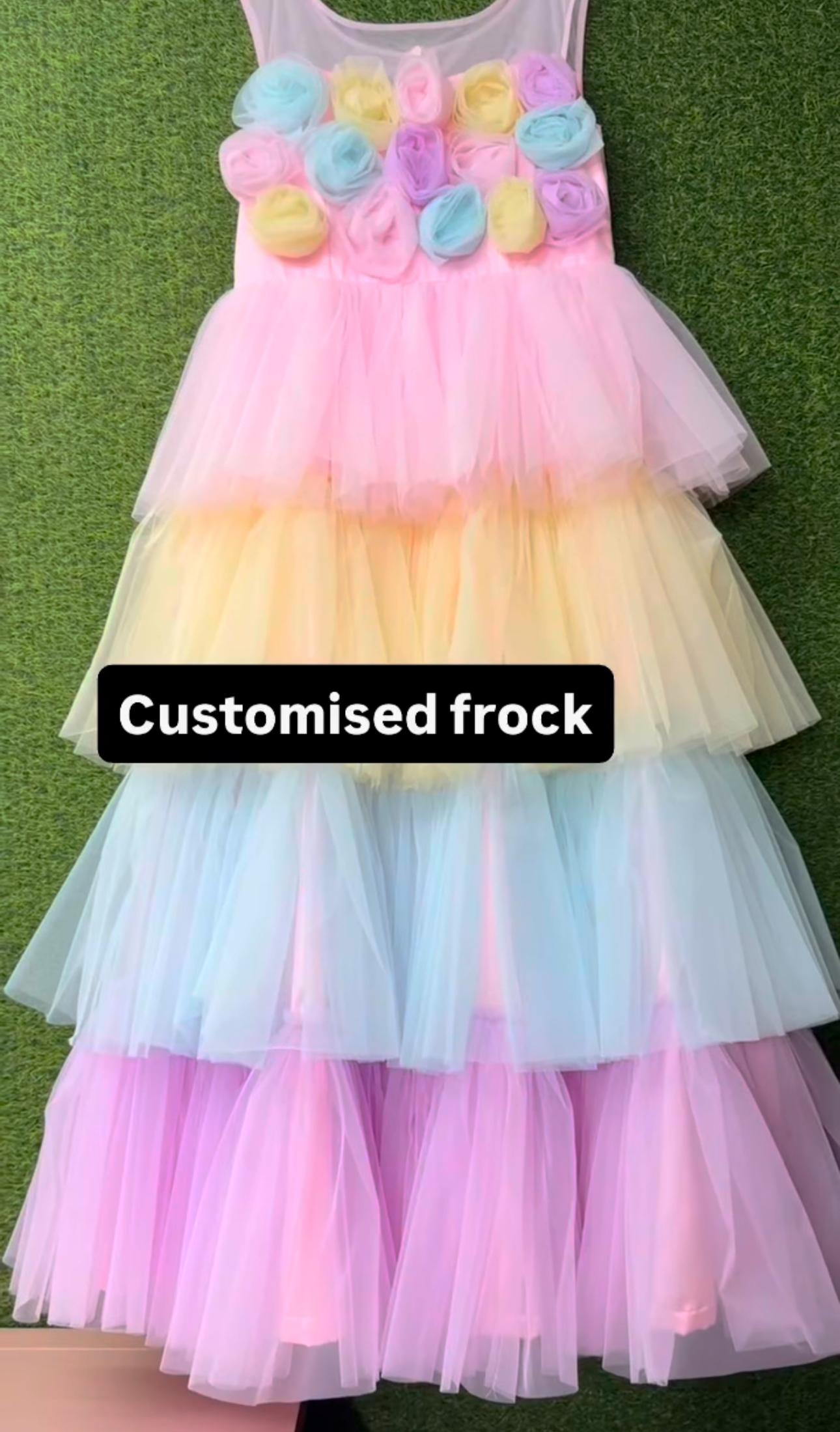 Customised pastel tulle layered frock with 3D floral embellishments