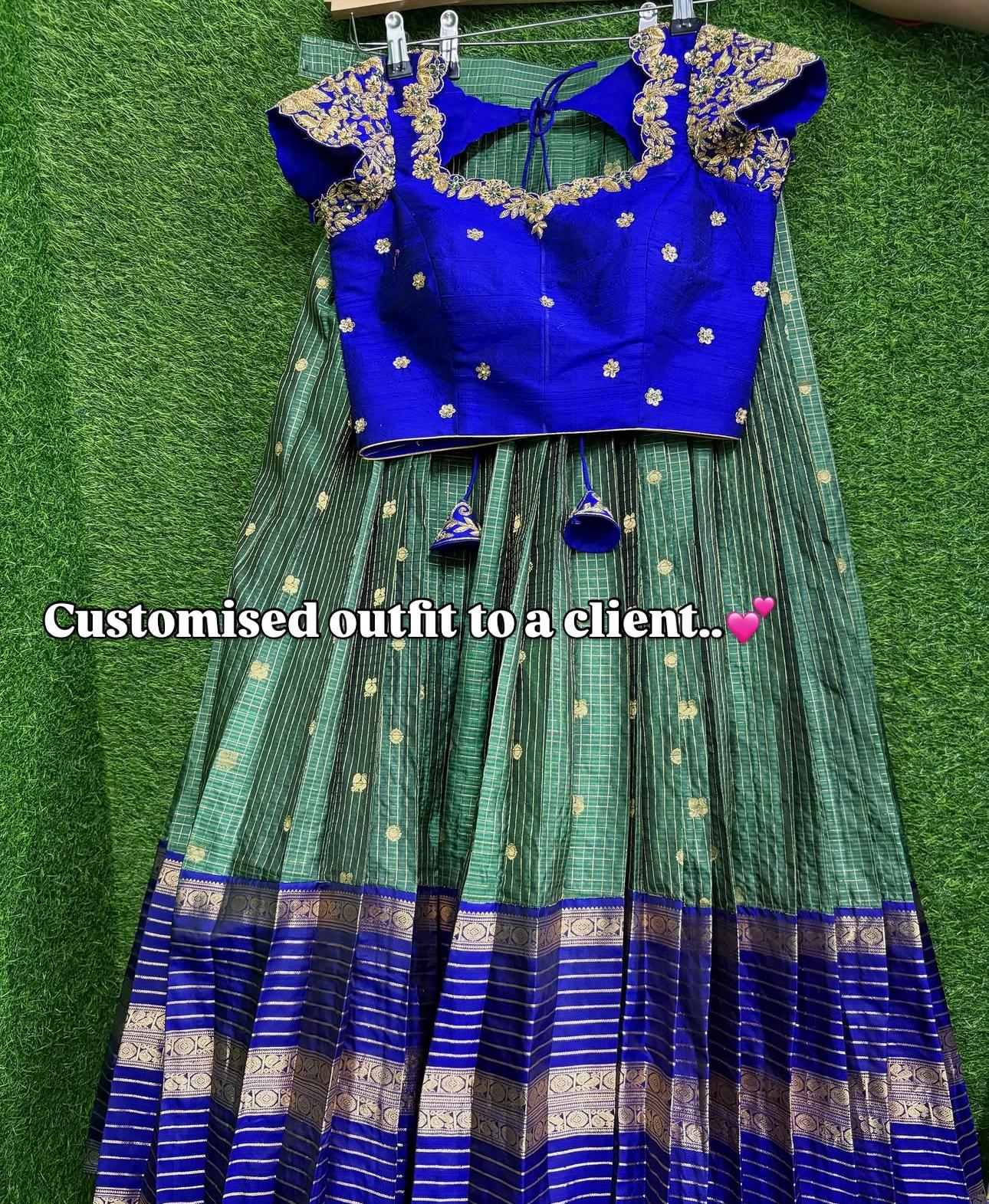 Royal blue blouse with gold maggam work and green striped saree