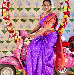 Purple silk saree with vibrant embroidered borders and golden accents