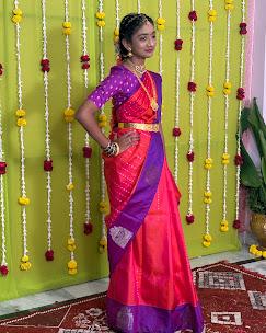 Bright red and purple half saree with maggam work embroidery