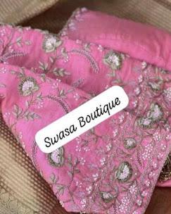 Pink silk saree with intricate floral embroidery and embellishments