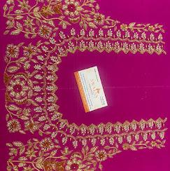 Magenta silk saree with elaborate gold zari embroidery borders