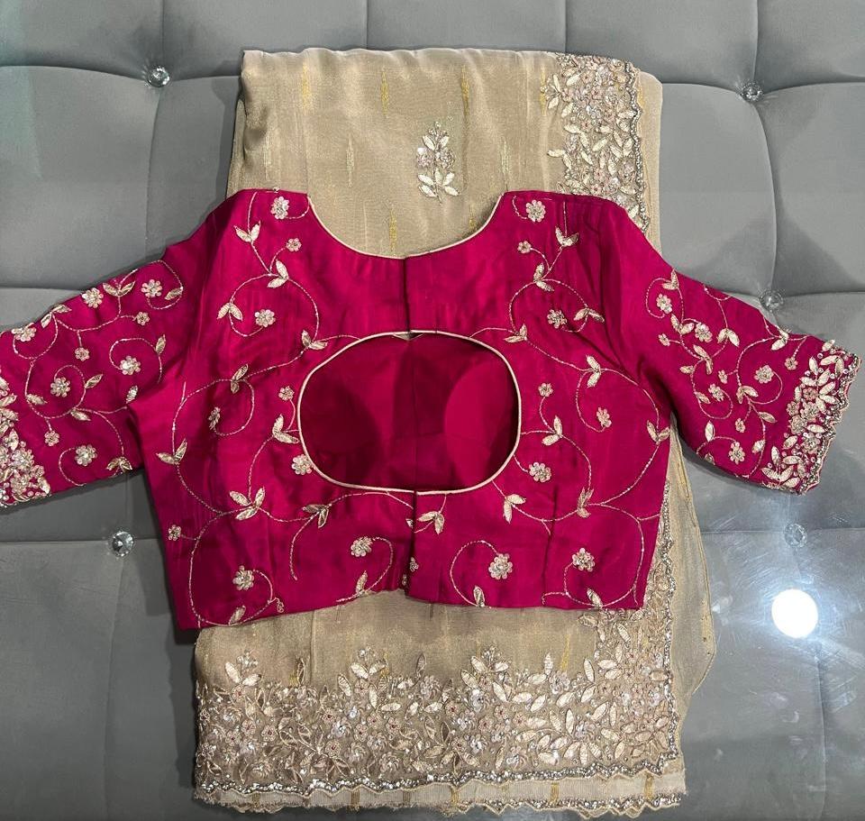 Maroon bridal blouse with gold floral embroidery and cutout neckline