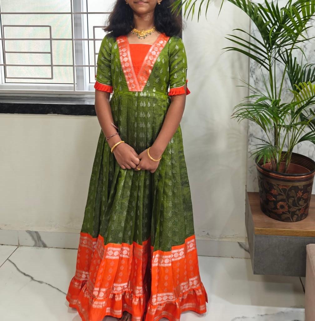 Green and orange traditional kurti with red embroidered V-neckline and contrasting hem