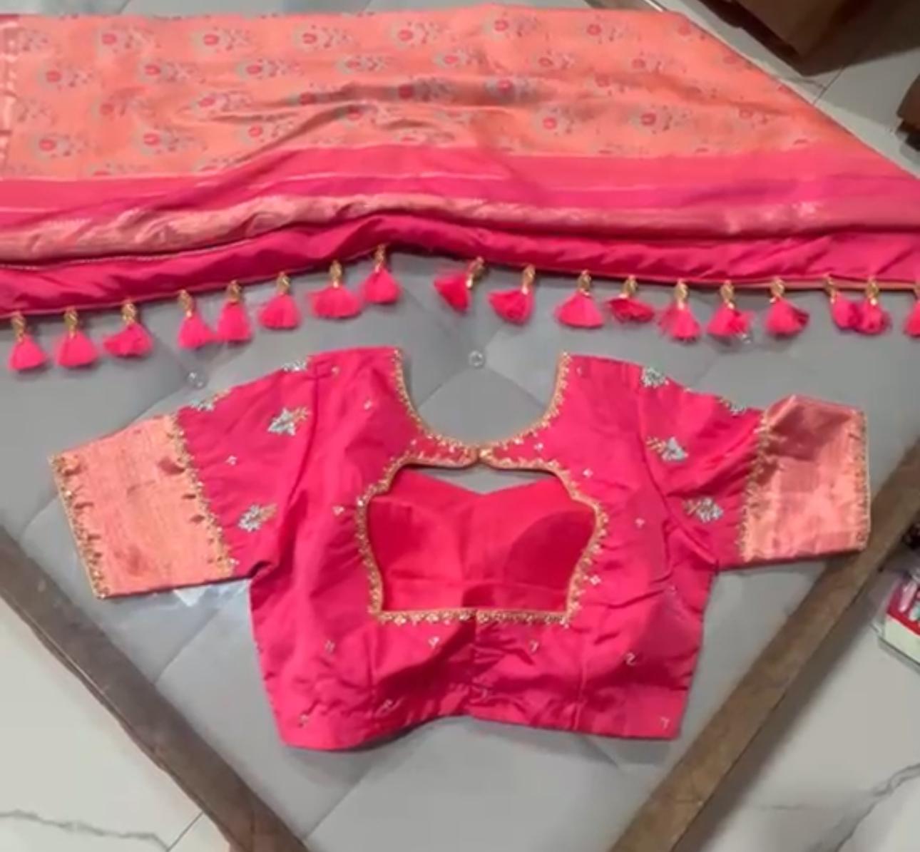 Bright pink bridal blouse with gold zari embroidery and scalloped neckline