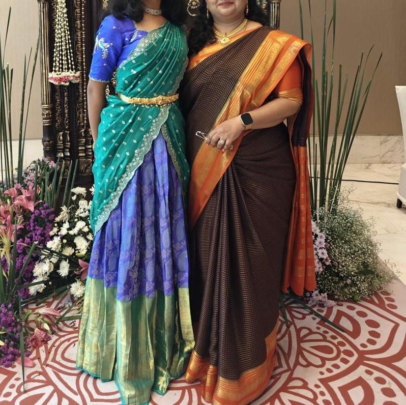 Teal lehenga with blue blouse and gold border dupatta