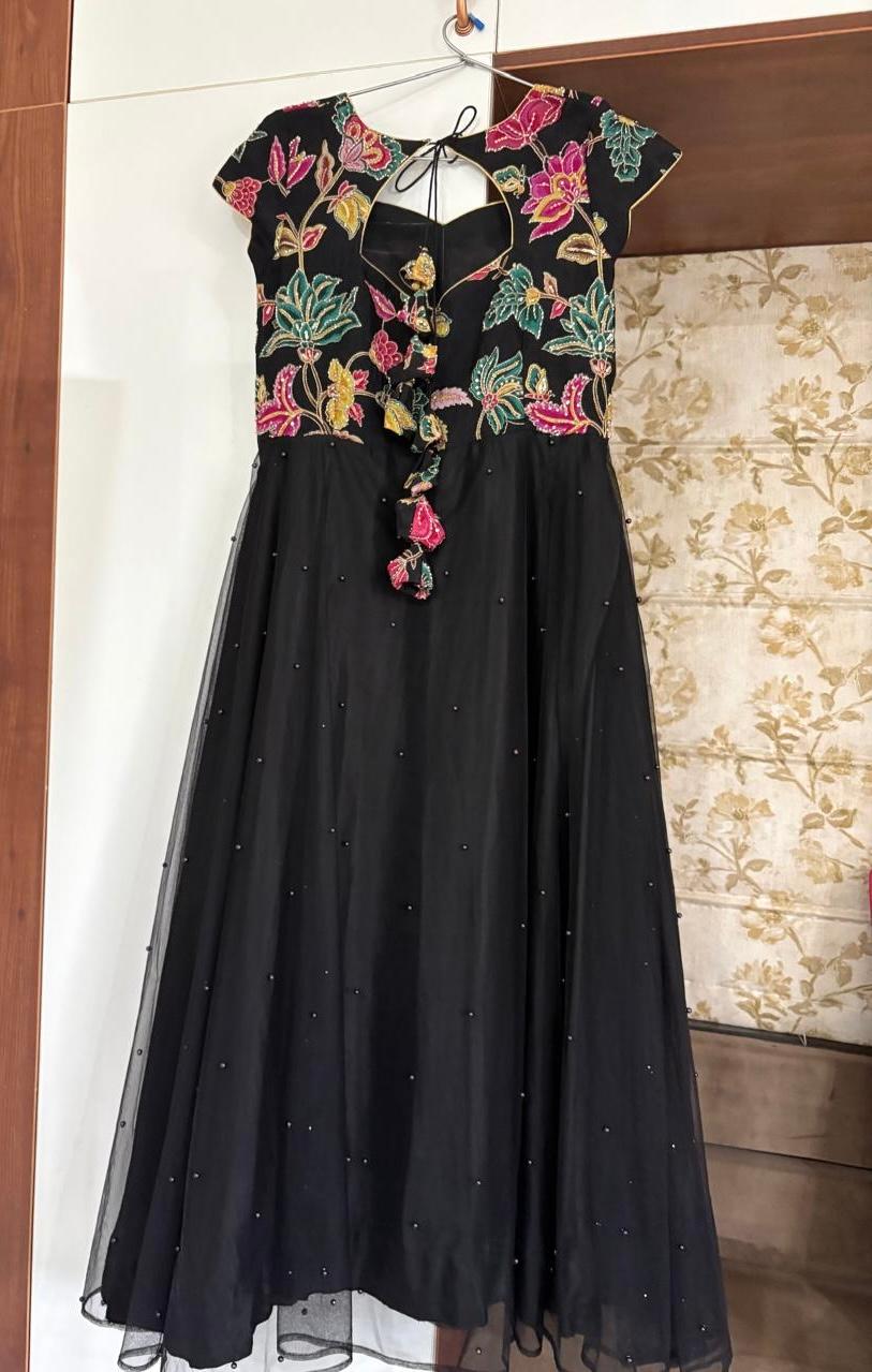 Black gown with colorful floral embroidered bodice and pearl beading