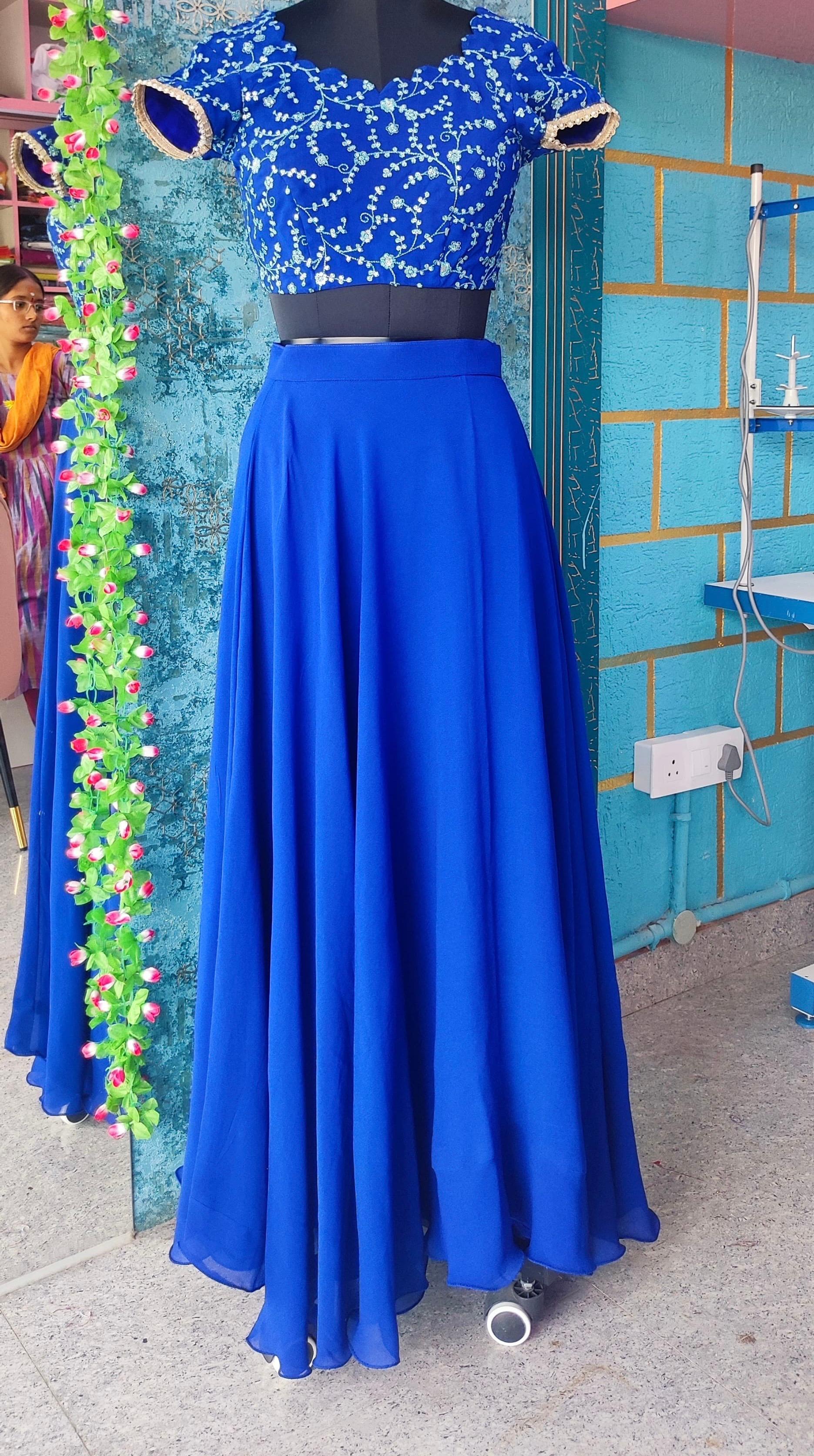 Royal blue lehenga with embellished blouse and flowing skirt