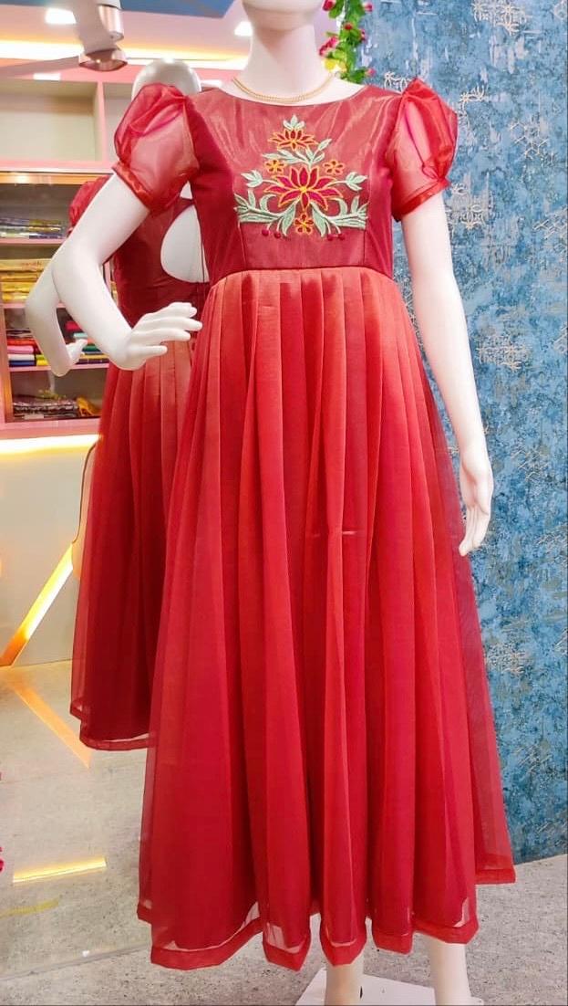 Red puff sleeve gown with gold floral embroidery and pleated skirt