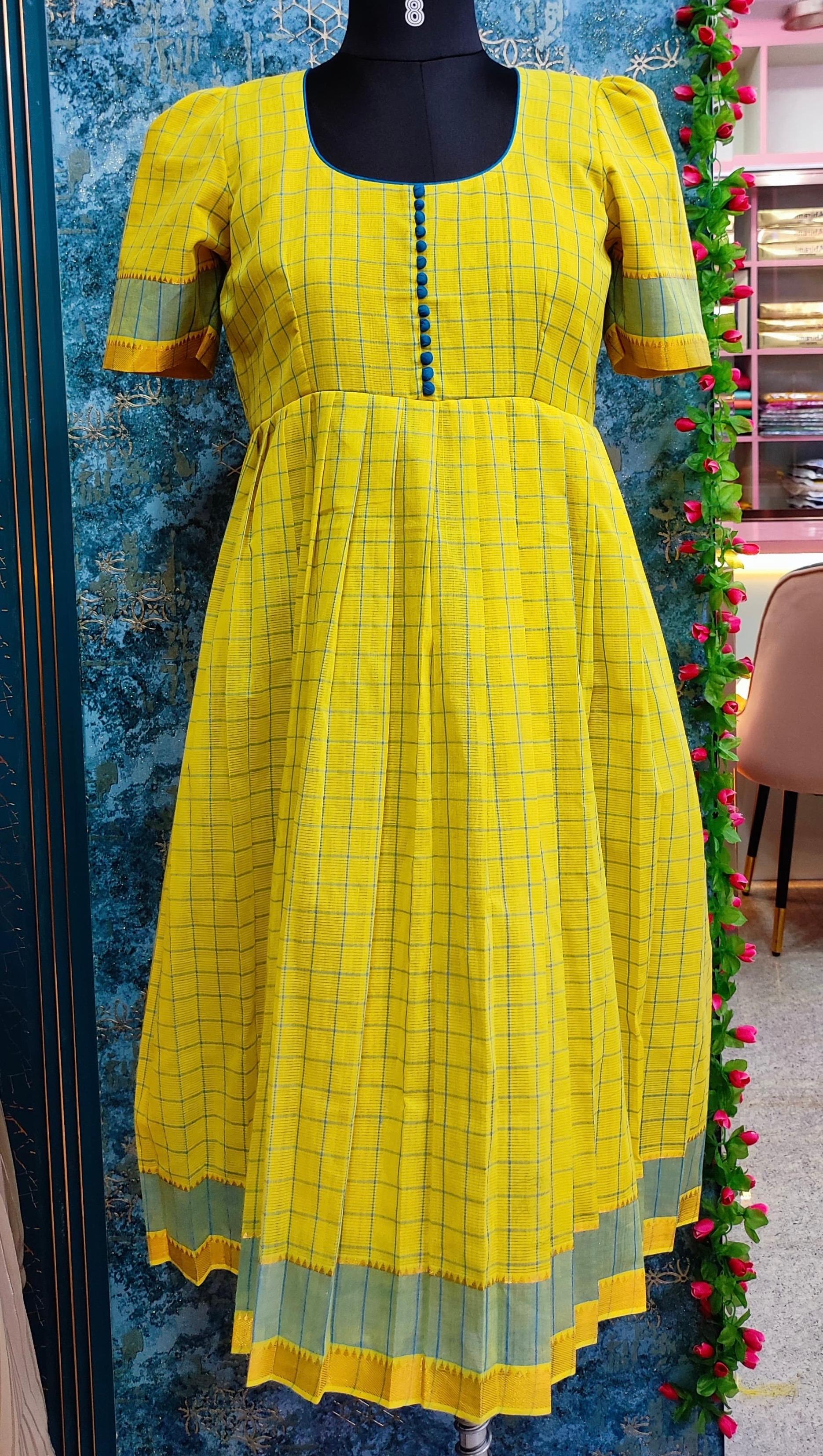 Yellow checkered kurti with contrasting green and gold borders