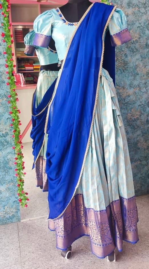 Blue and cream silk saree with purple zari border and puff sleeve blouse