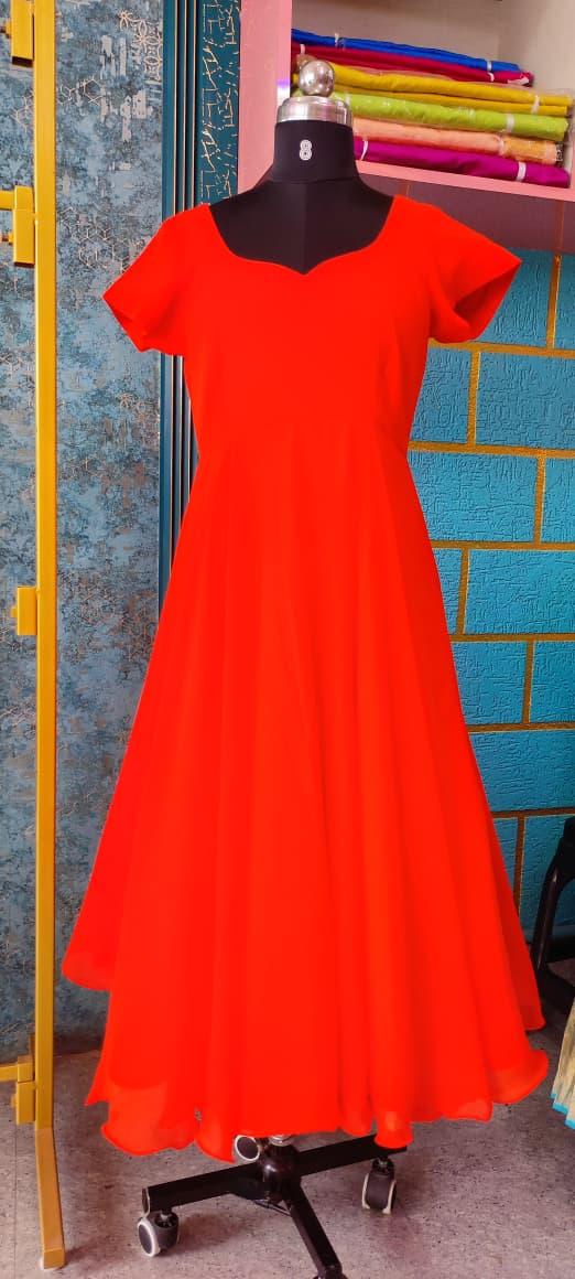 Vibrant red A-line gown with short sleeves and flowing silhouette