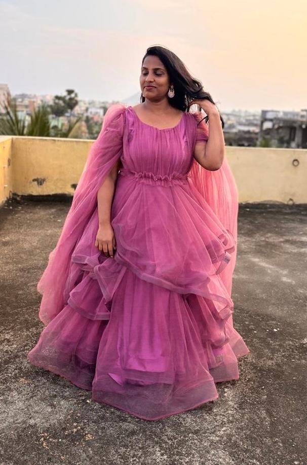 Mauve tulle gown with layered ruffles and cold-shoulder cape sleeves