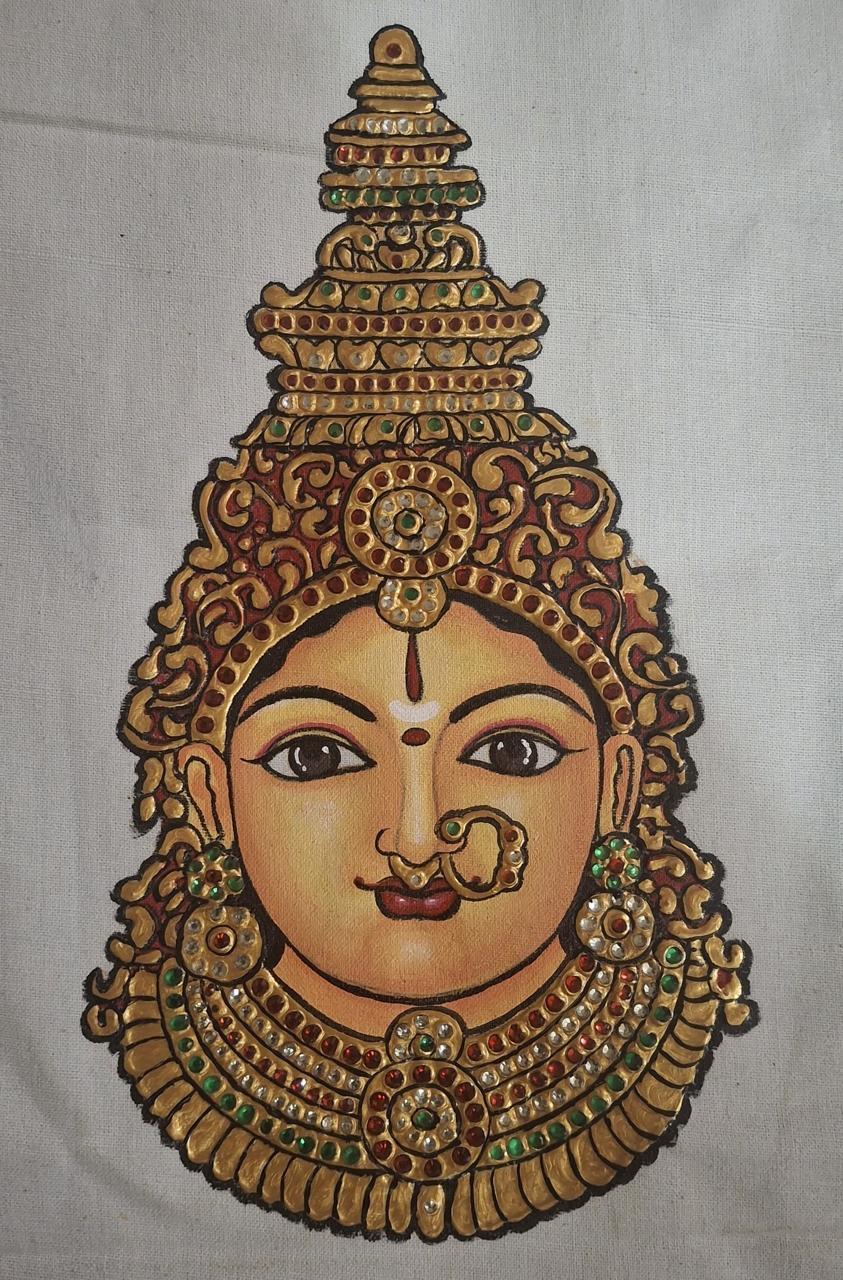 Gold temple deity head with ornate crown and jeweled embellishments