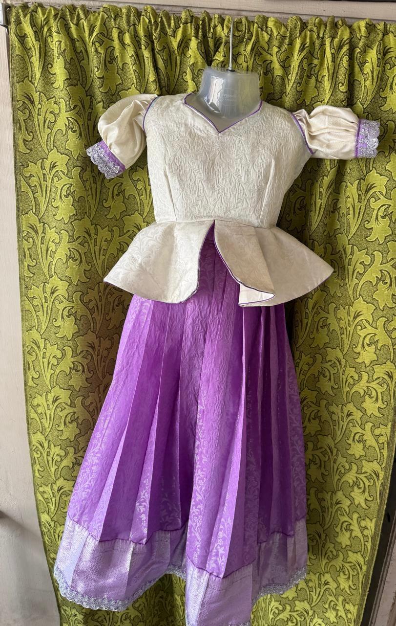 Cream and purple half saree with puffed sleeves and lace border