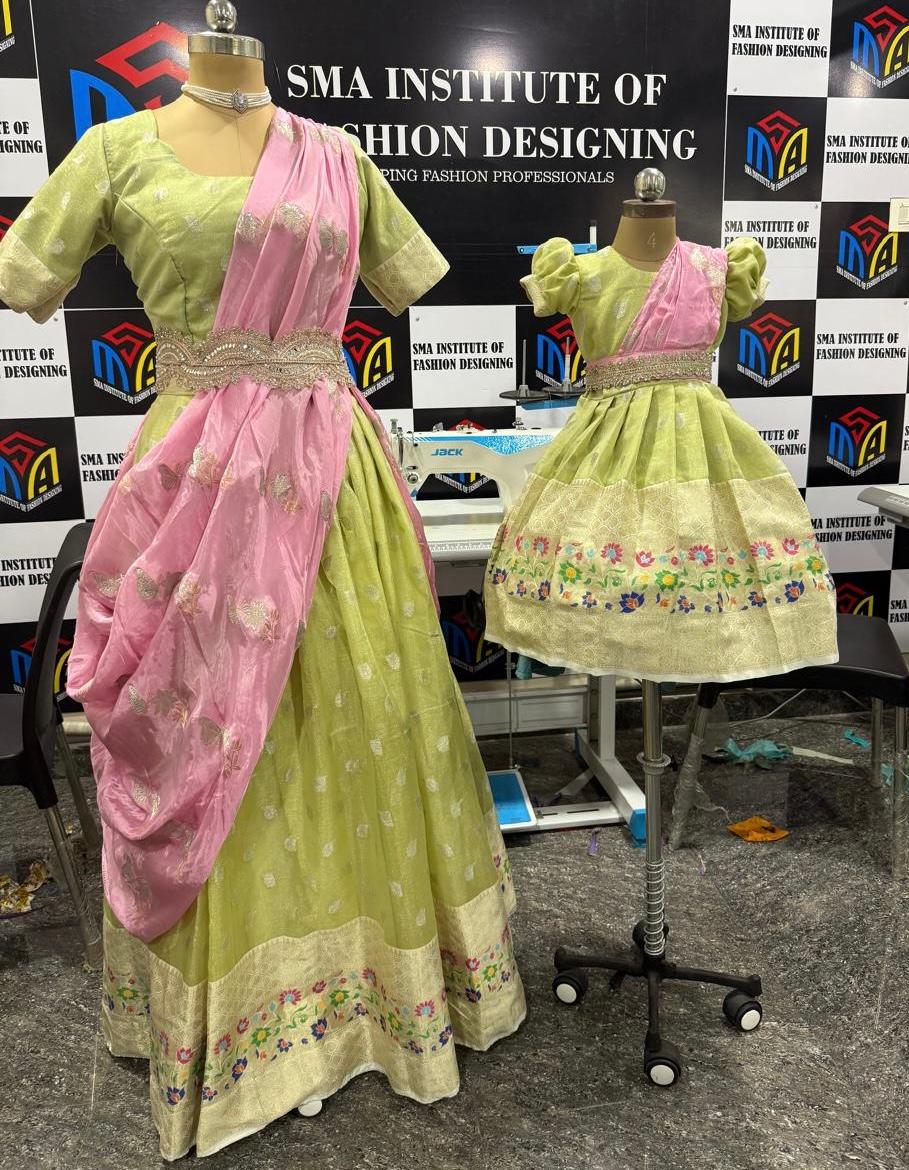 Green silk saree with pink drape and floral embroidered border