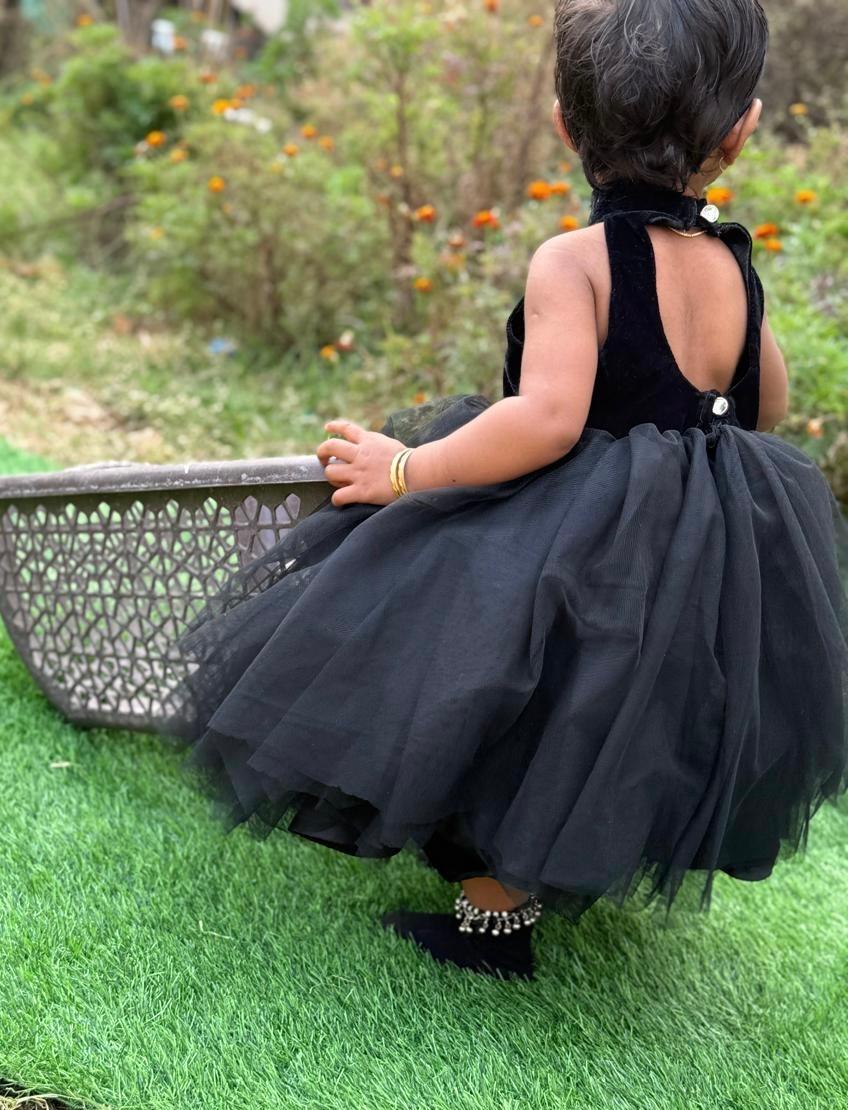 Black tulle gown with halter neckline and pearl embellishments