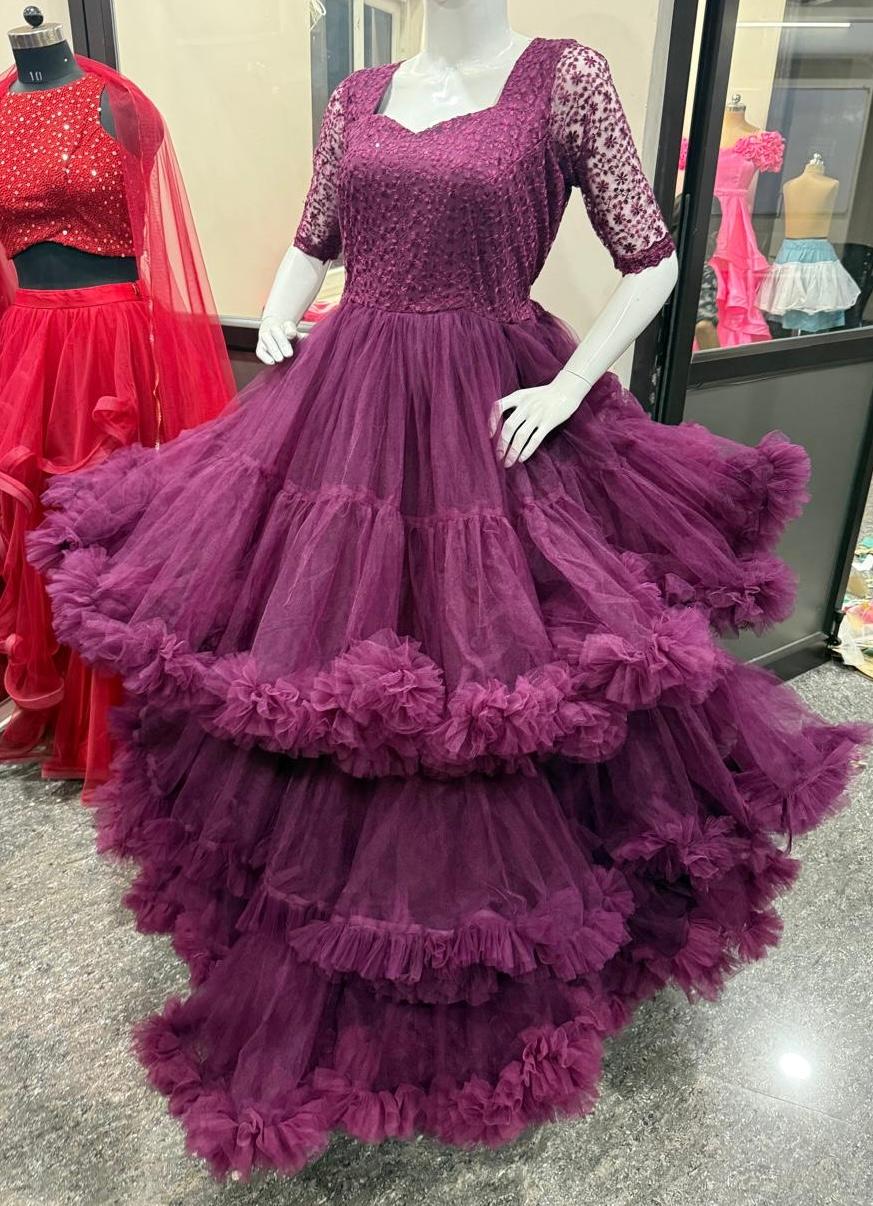 Purple tulle gown with sequined bodice and layered ruffled skirt