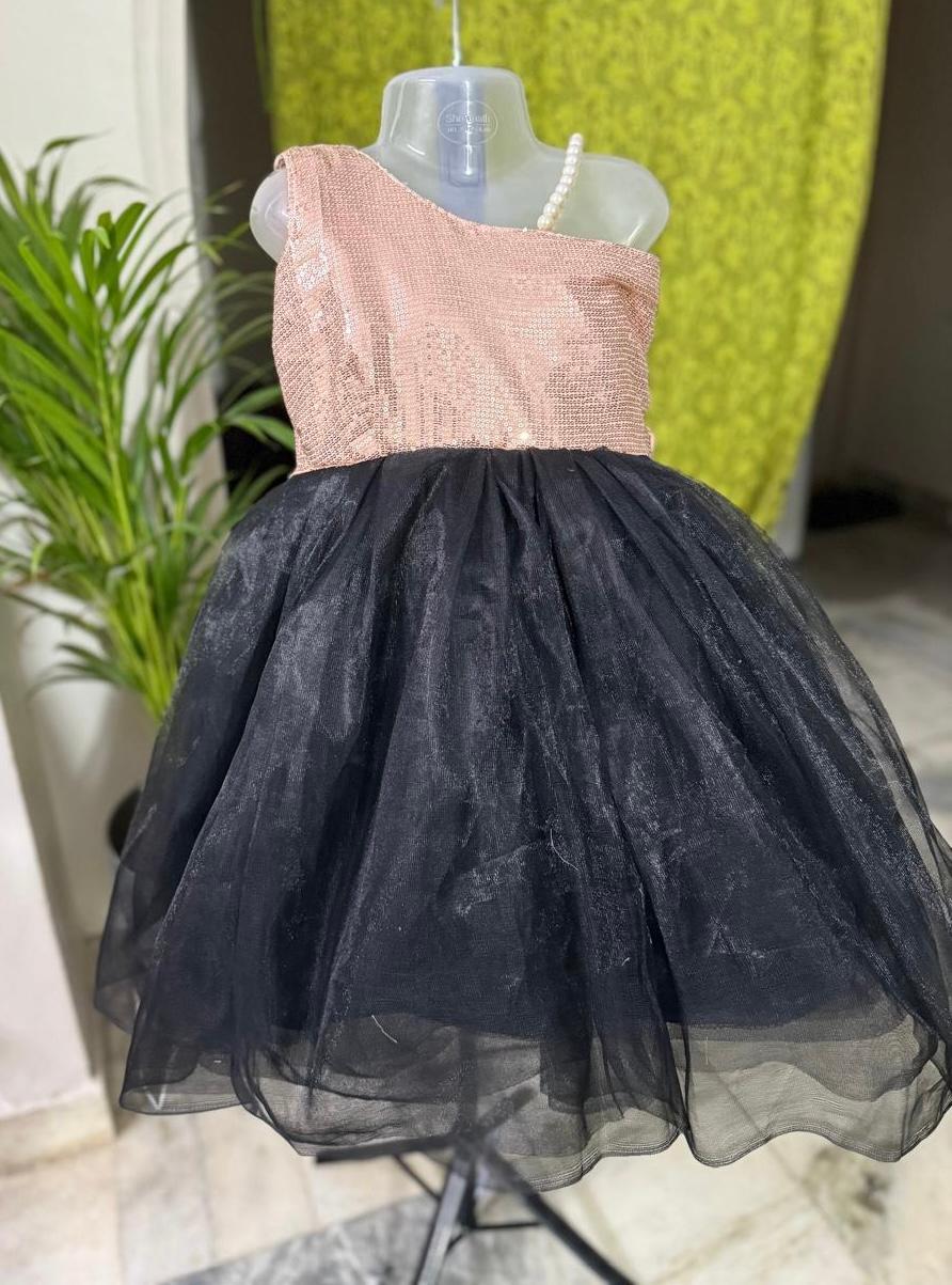 Peach sequined one-shoulder top with black tulle skirt