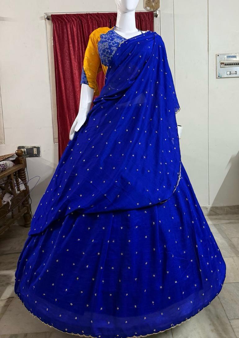 Royal blue lehenga with gold sequin embellishments and matching dupatta