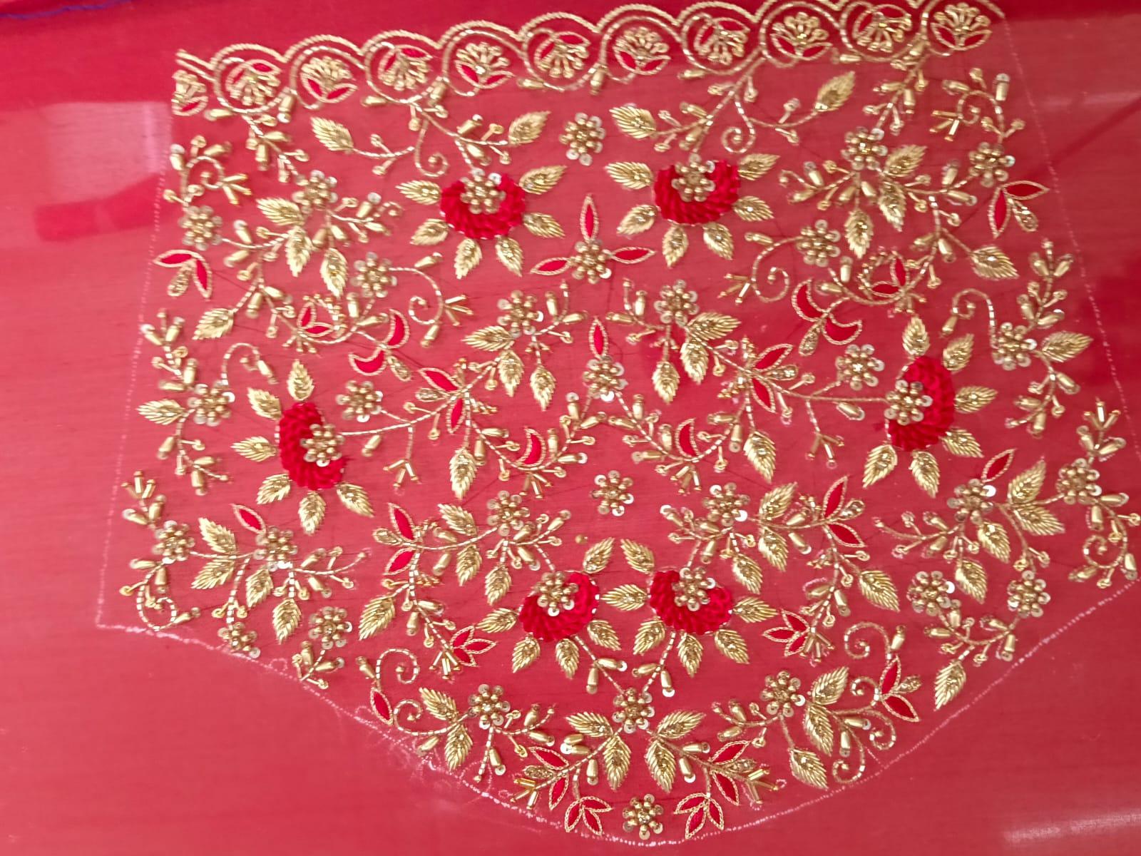 Red saree blouse with gold zari floral embroidery and ornate border