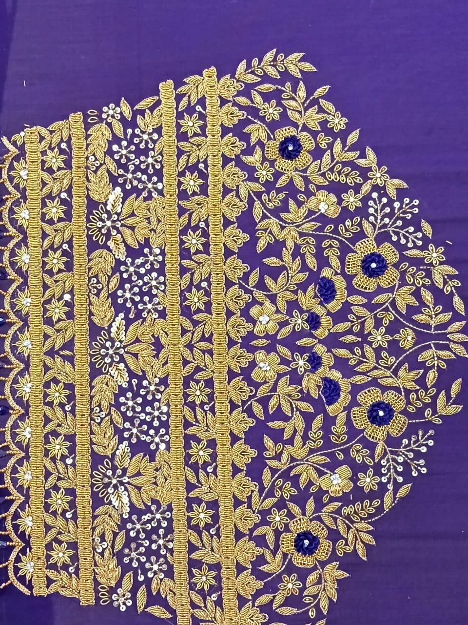 Purple blouse with dense gold zari floral embroidery and blue accents