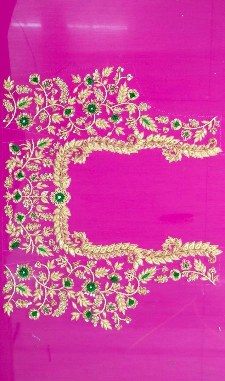 Magenta silk saree with gold zari and green stone embroidery border