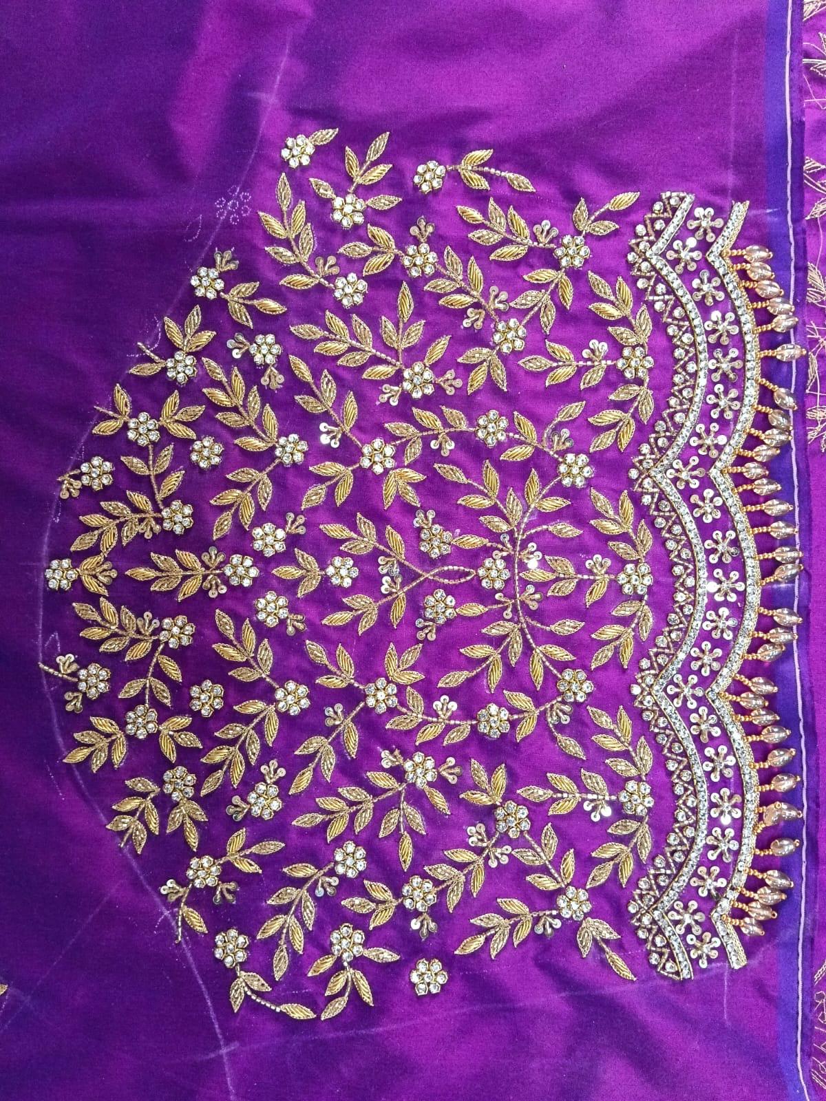Purple silk saree with gold zari floral embroidery and pearl border