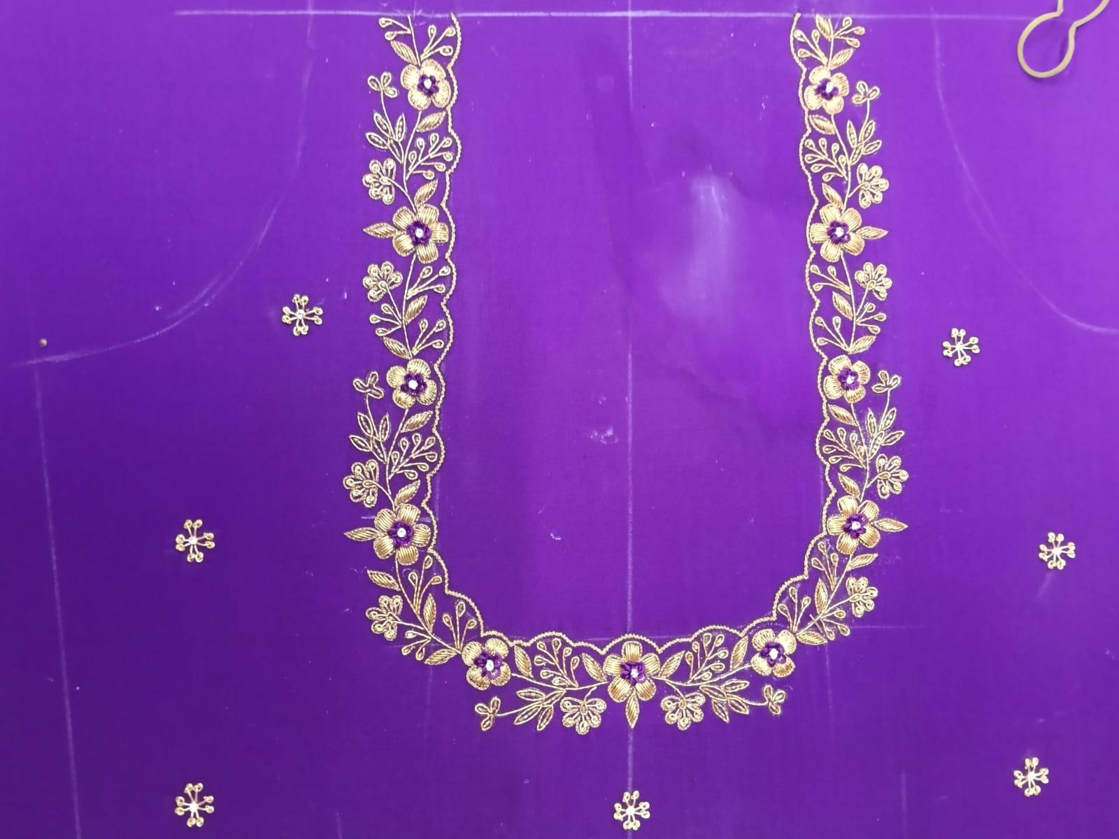 Purple blouse with gold floral zari embroidery and decorative neckline