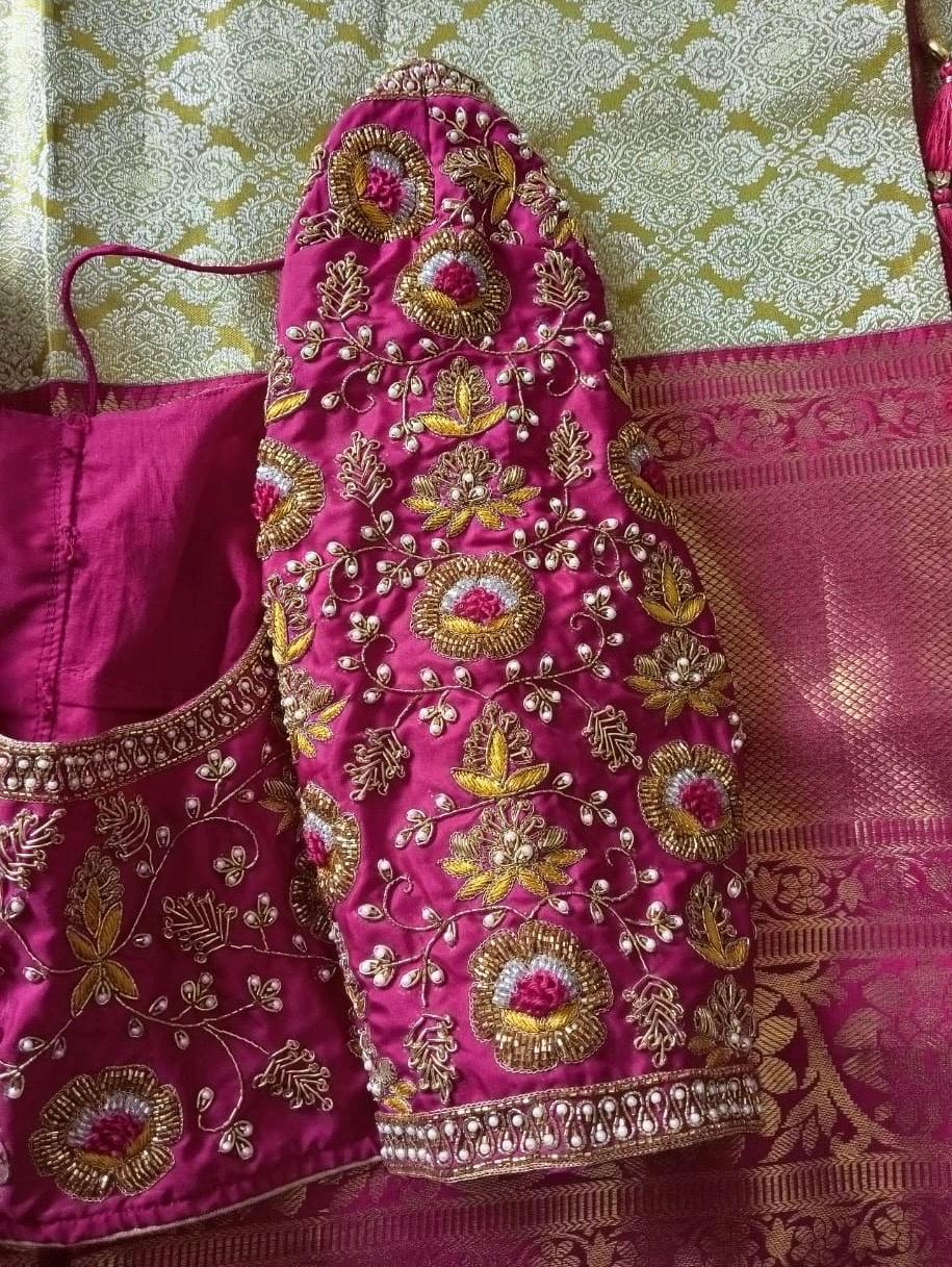 Magenta bridal blouse with gold maggam work and pearl embellishments