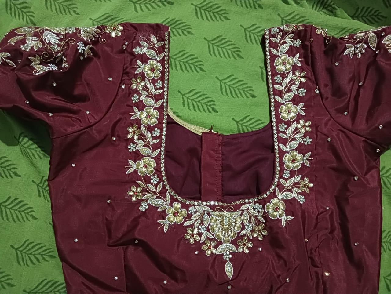 Maroon bridal blouse with gold zari floral embroidery and stones