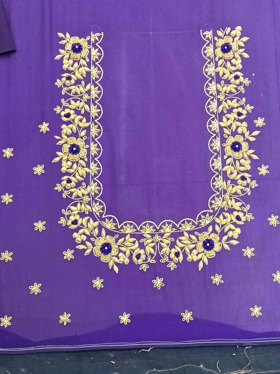 Purple saree with gold zari floral embroidery and blue accents
