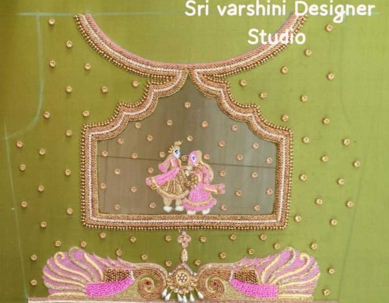 Green blouse with gold beadwork and pink embroidered figures