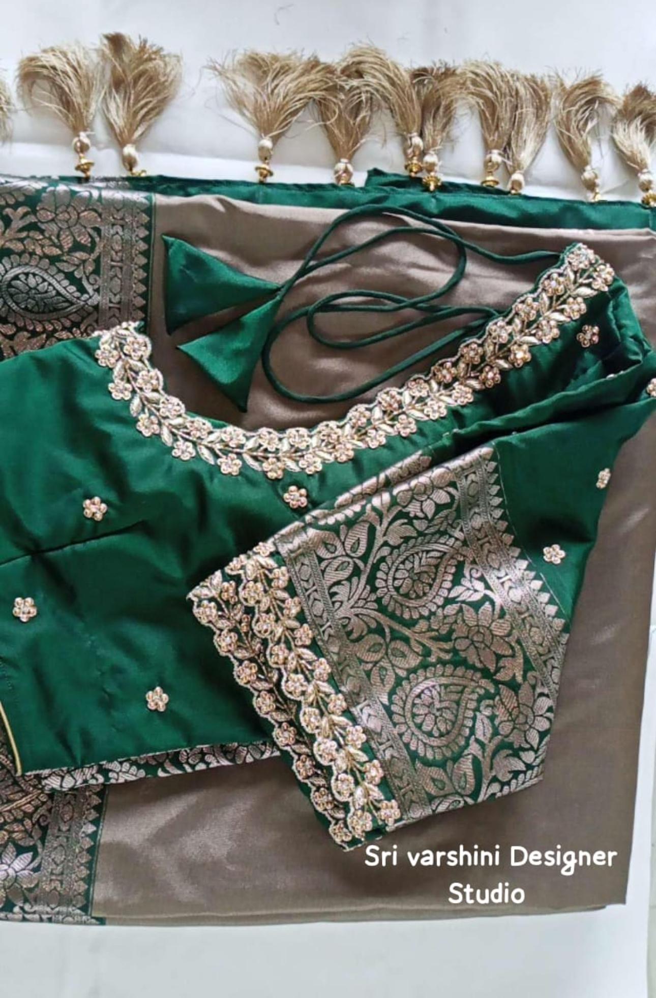 Green silk saree with ornate gold zari and stone embroidery