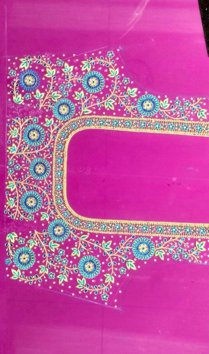 Magenta blouse with intricate maggam work and floral embroidery border