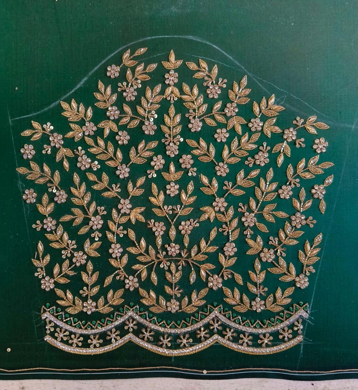 Green bridal blouse with gold zari floral and leaf embroidery