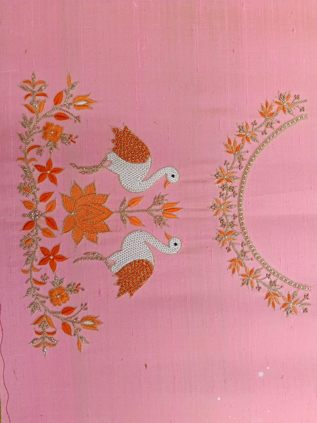 Pink blouse with orange floral embroidery and decorative birds design