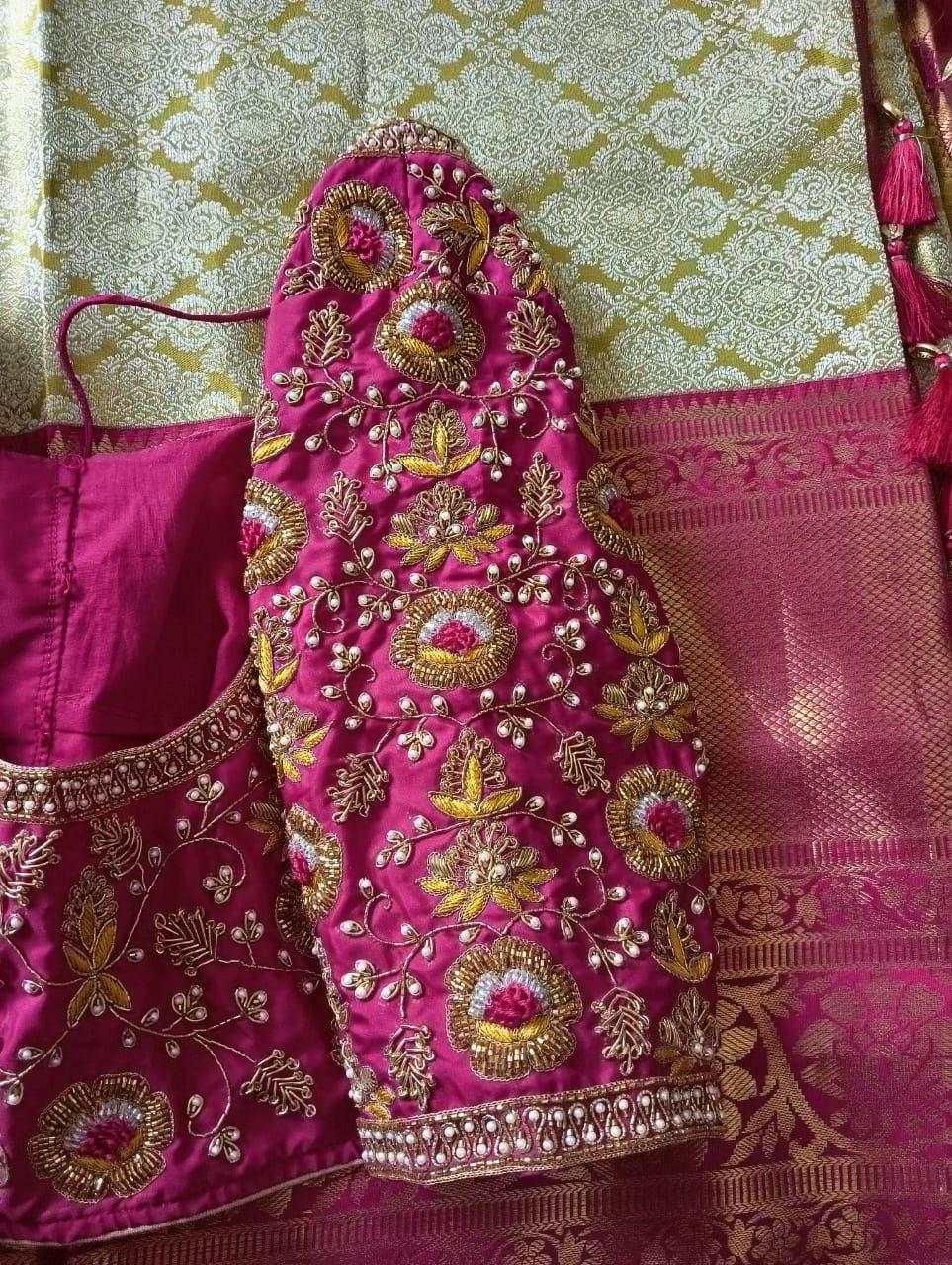 Magenta bridal blouse with gold zari and pearl maggam work embroidery