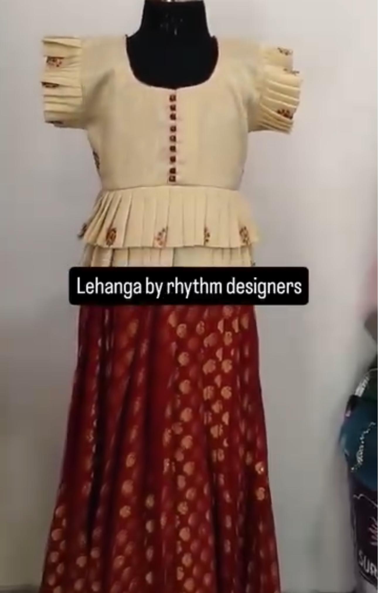Cream and maroon lehenga with pleated blouse and embroidered skirt