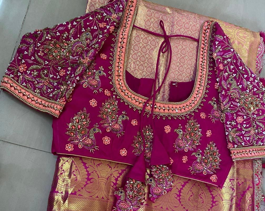 Magenta bridal maggam work blouse with heavy zari embroidery and designer sleeves by Deepika Boutique Hanamkonda