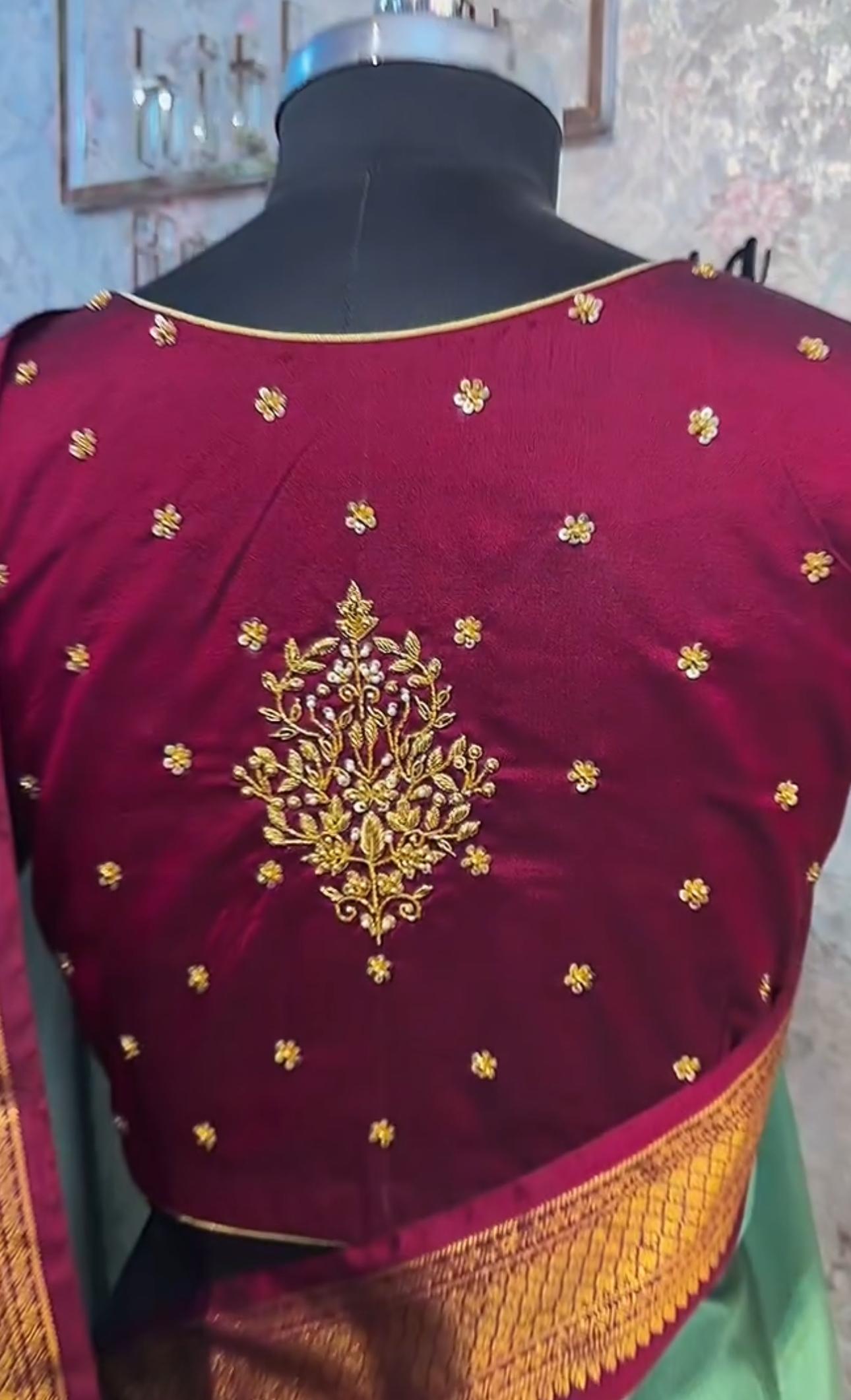 Maroon bridal blouse with elegant maggam work back design