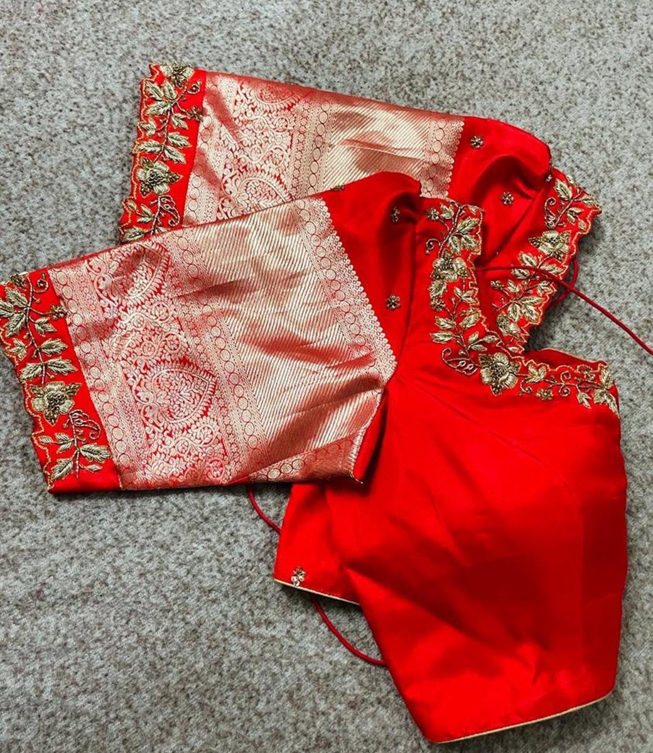 orange blouse sleeve with elegant floral maggam work embroidery