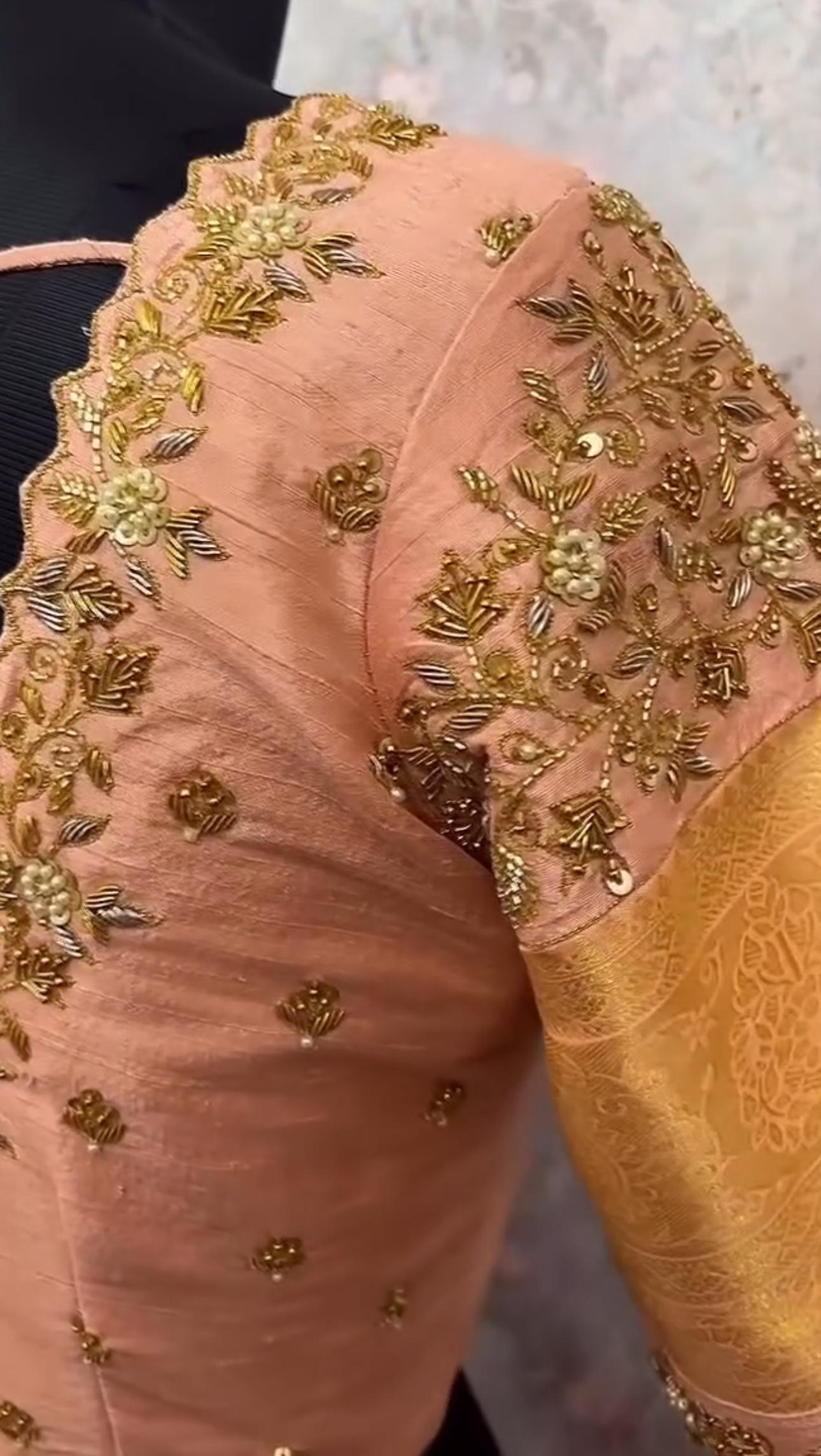 Peach blouse sleeve with delicate floral maggam work