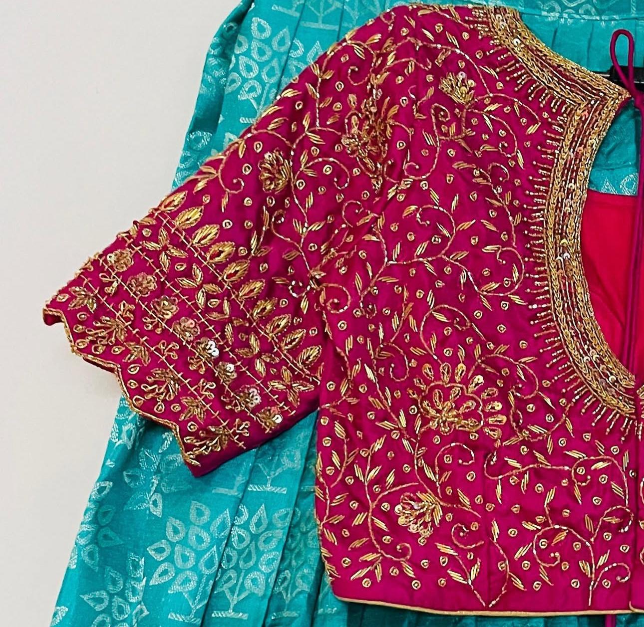 Pink bridal blouse sleeve with dense floral maggam work
