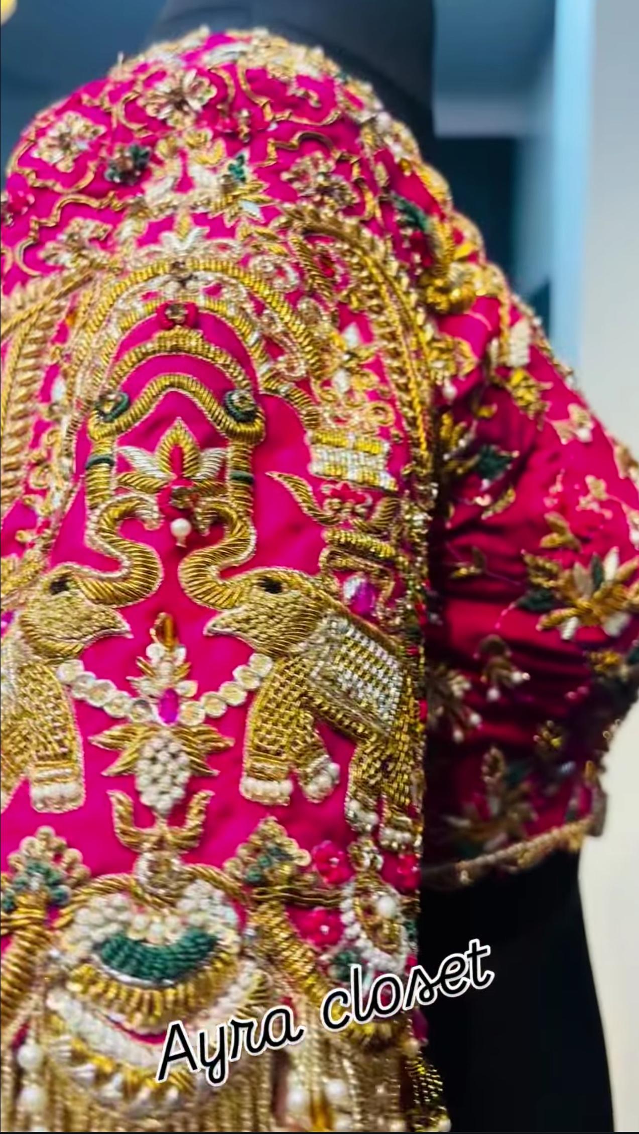 Pink bridal blouse shoulder with elephant maggam work embroidery