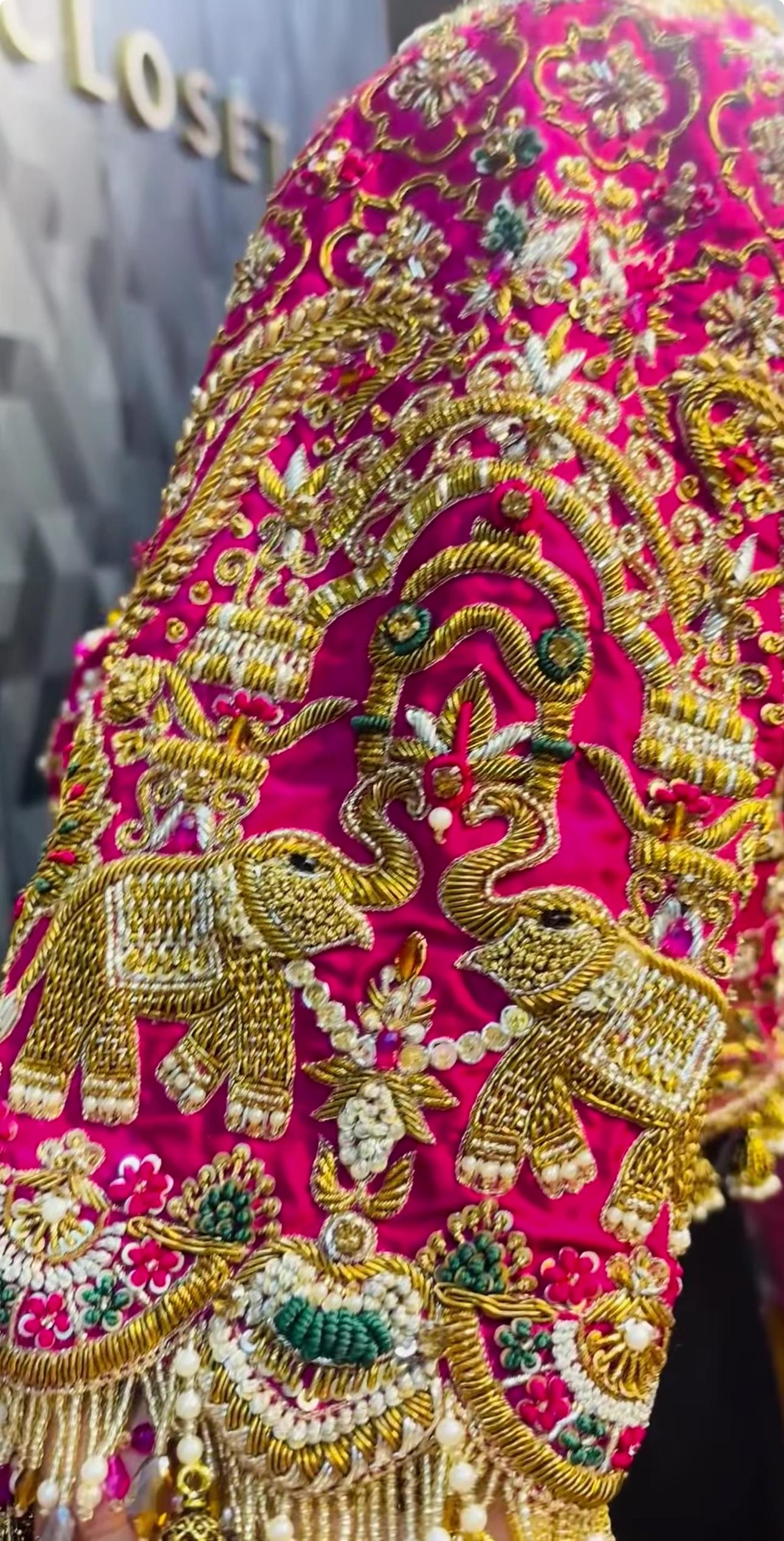 Traditional pink bridal blouse with elephant maggam work embroidery