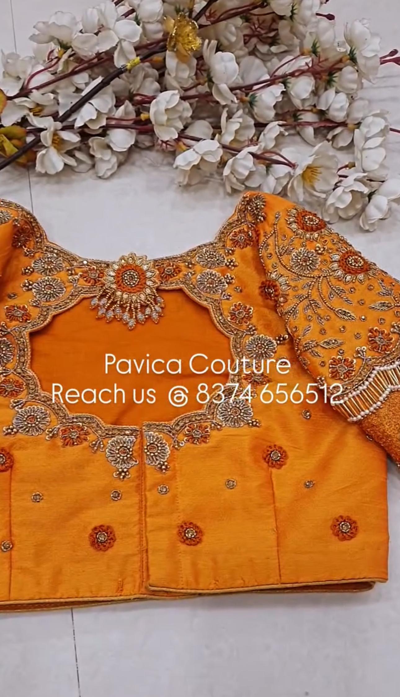 Orange bridal designer blouse with intricate maggam embroidery from Pavica's Couture Hyderabad