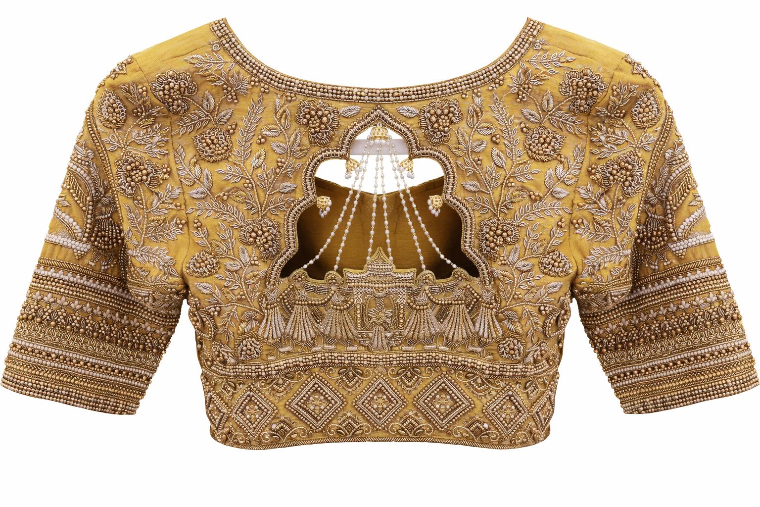 Mustard bridal maggam work blouse with pearl embroidery and stylish back neck cutwork design.
